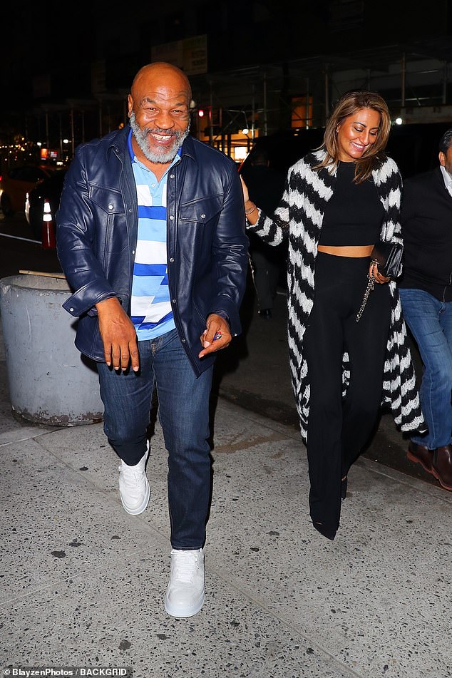 Mike Tyson looks in good spirits while dining with a female pal after the shocking Sciatica battle Daily Mail