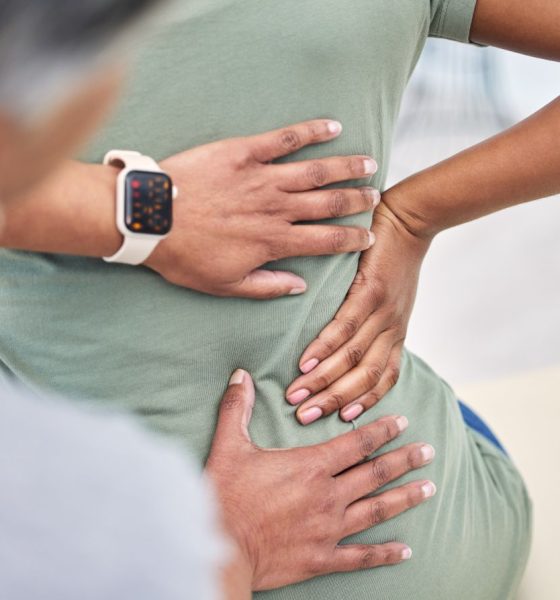 lower back pain hand on patient