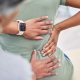 lower back pain hand on patient